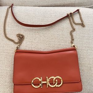 Jimmy Choo, 8 x 5 1/2 x 2 Crossbody bag and a dusty rose color